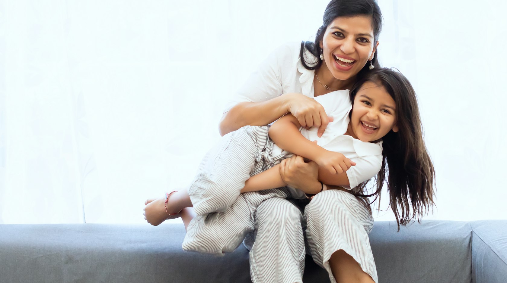 A domestic worker caring for a child at home